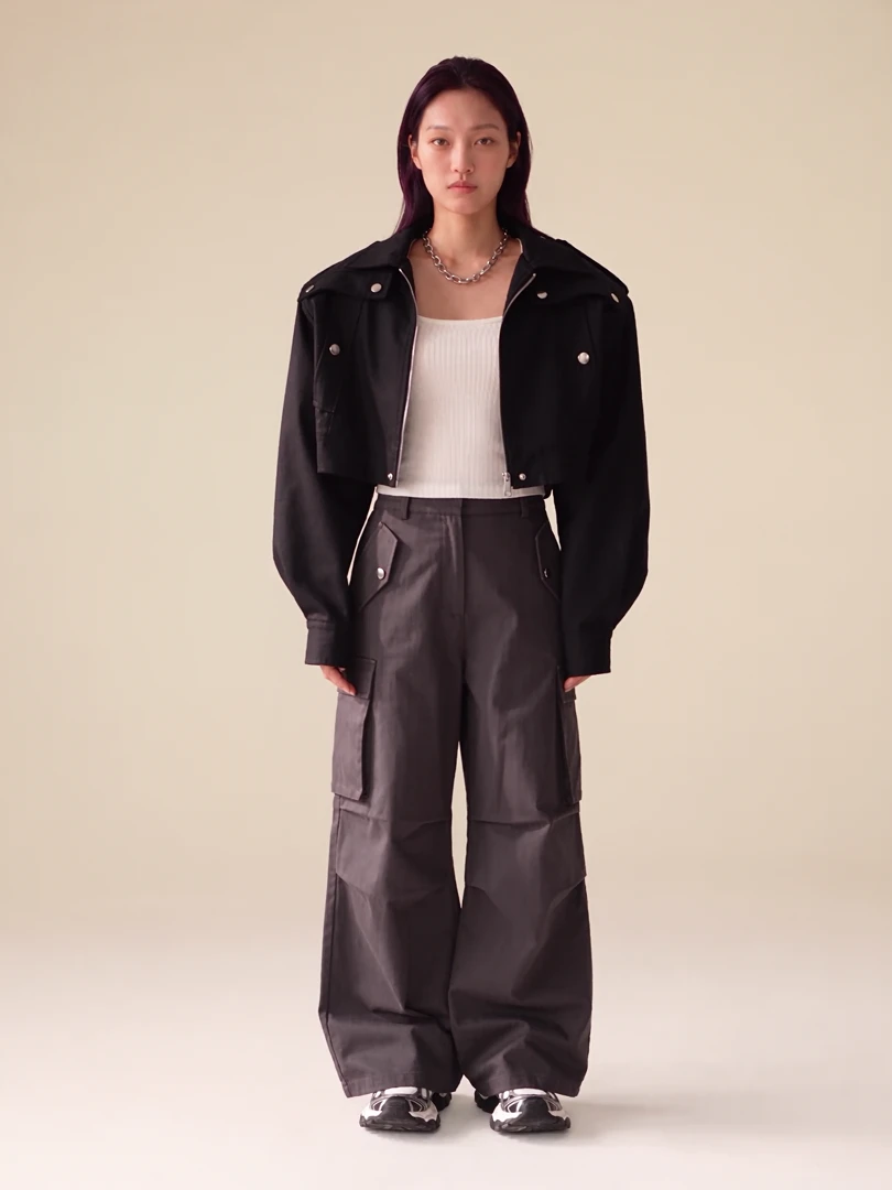 Yuna wearing a K-pop-inspired streetwear look, straight on