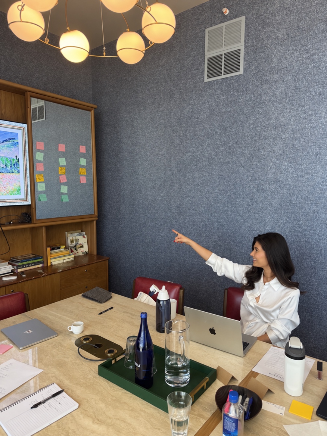 A SPREEAI teammate pointing toward ideas during an in-person working session