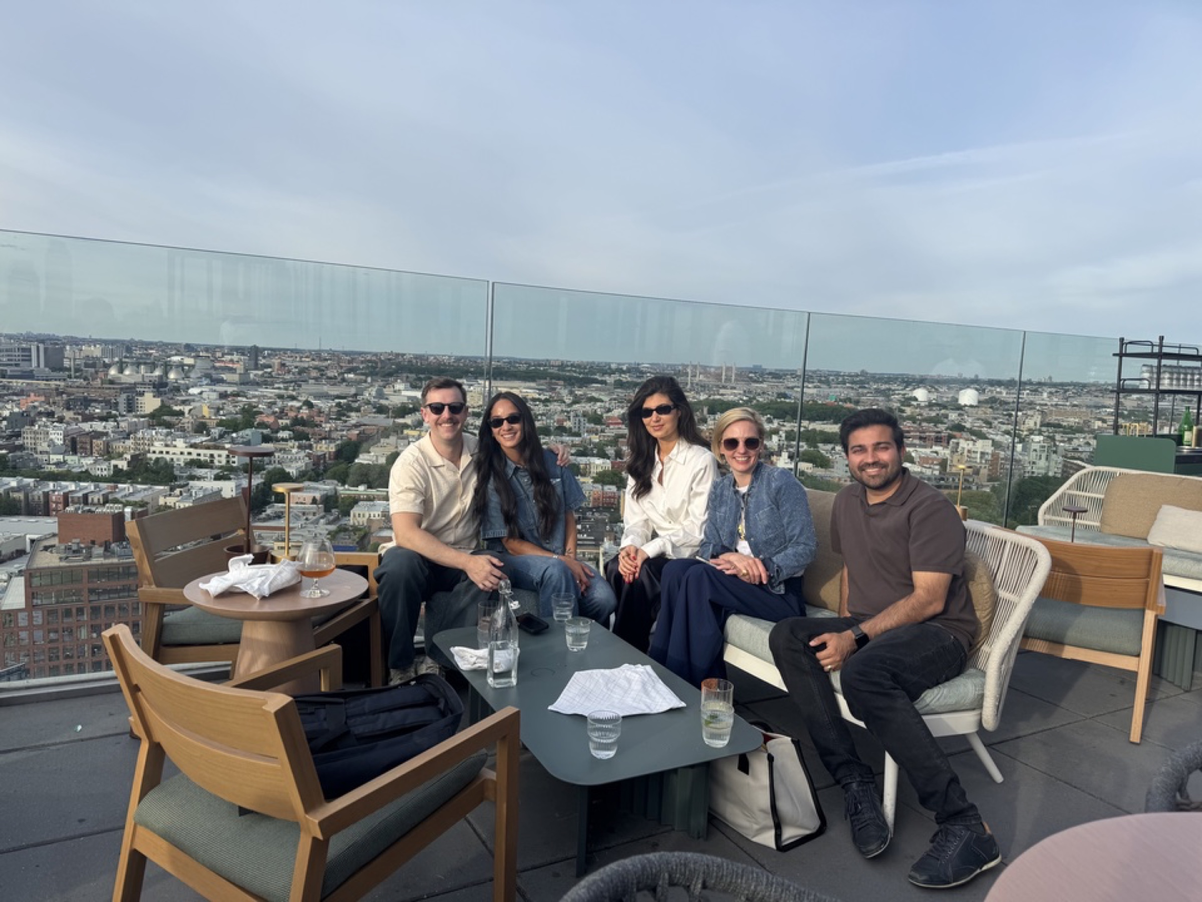SPREEAI teammates together on a rooftop after a working session